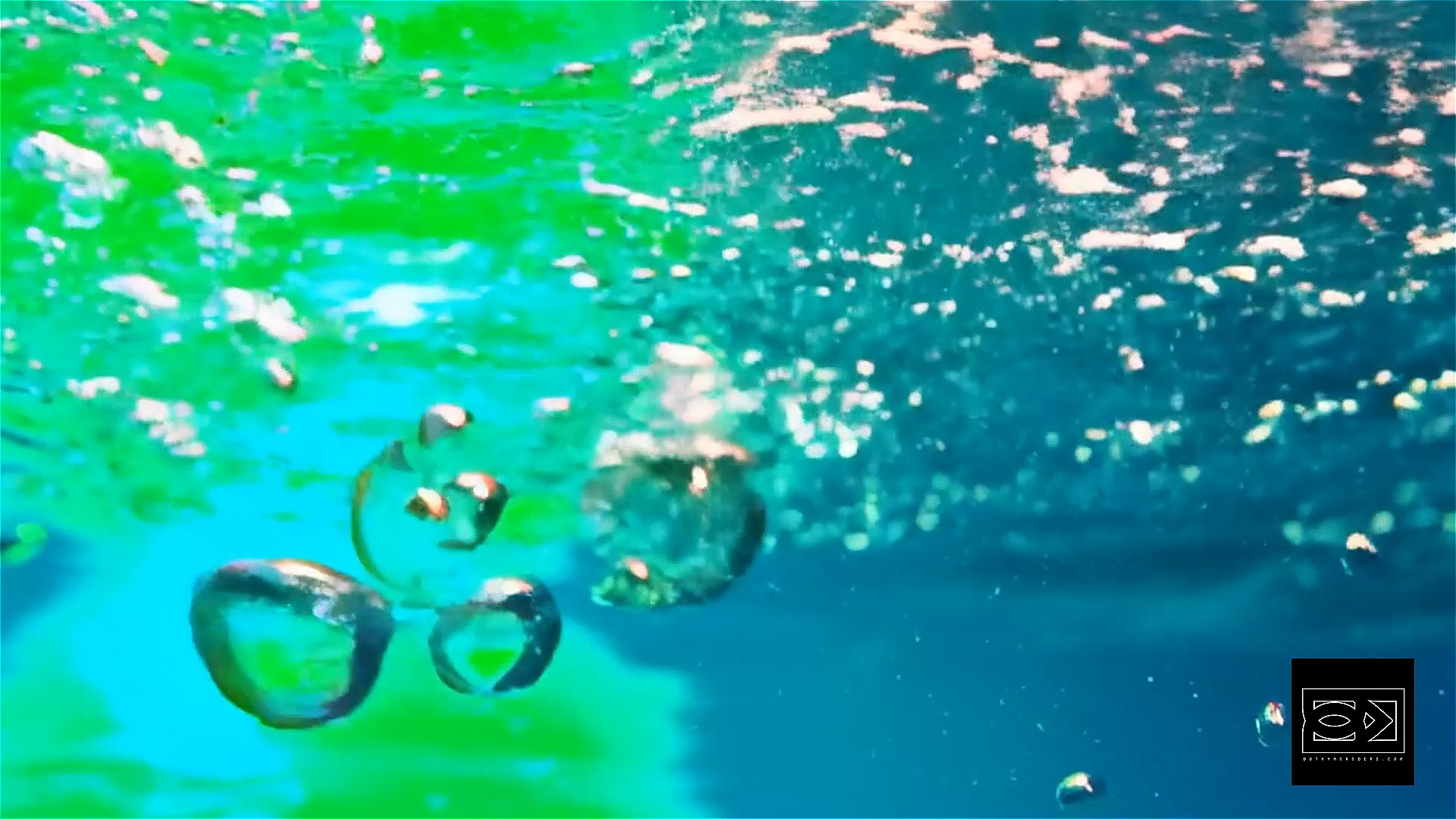 Underwater AI visual meditation – still frame, figure floating in deep blue water 01 Underwater AI visual meditation – still frame, figure floating in deep blue water 01