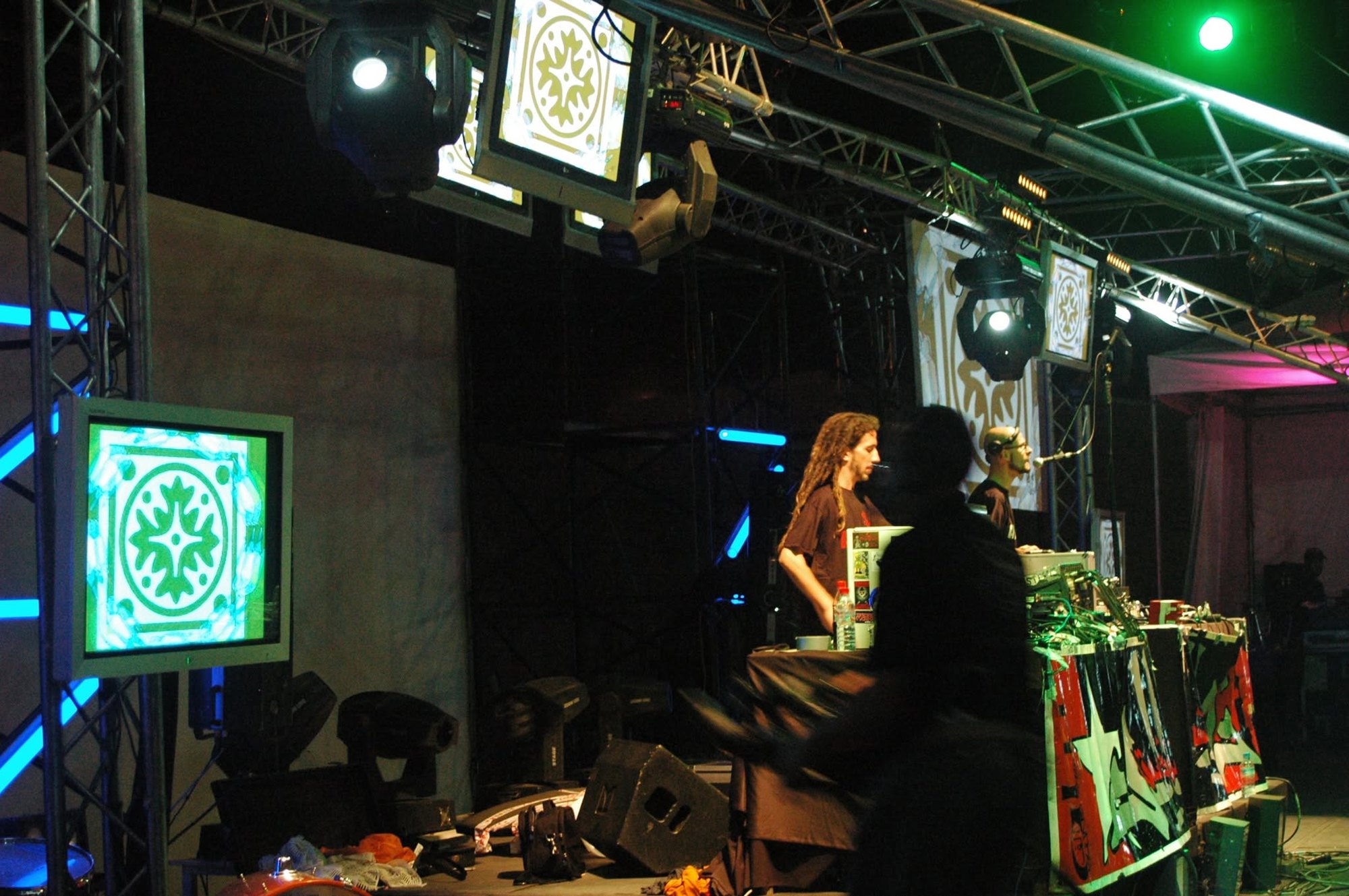 Stage built with trusses, monitors and projected visuals during a live show