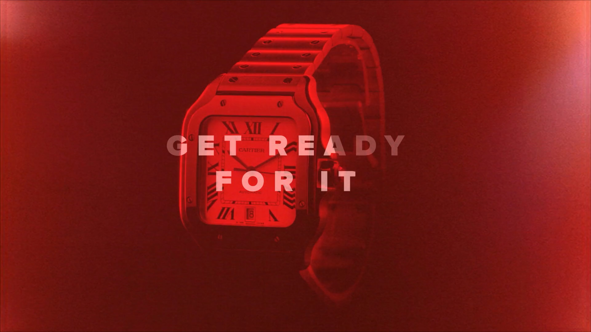 Cartier Santos watch in red lighting with the words Get ready for it